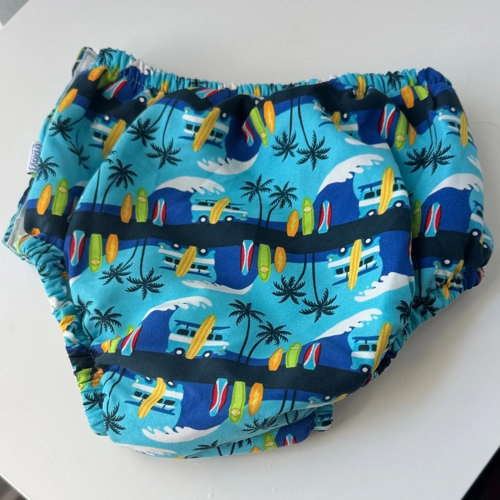 i play. Blue Surfboard and Palm Tree Swim Diaper